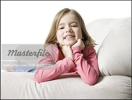 Portrait of a girl lying on a couch