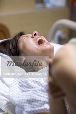 High angle view of a female patient showing uncomfortable expression