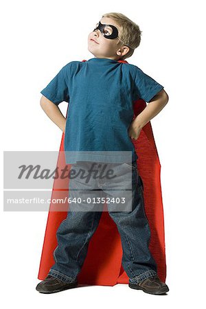 Young boy in superhero costume