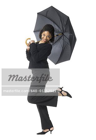 Portrait of a teenage girl holding an umbrella