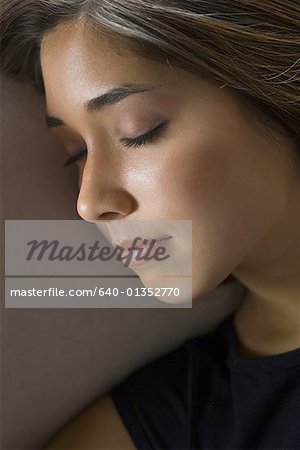 High angle view of a young woman sleeping