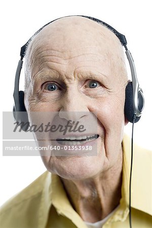 Portrait of a senior man listening to music on headphones