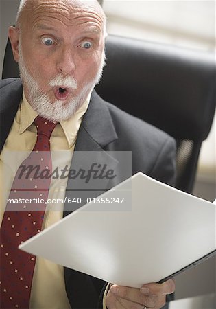 Close-up of a businessman holding a file