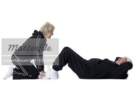 Older man doing sit-up exercises