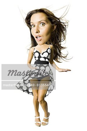 Woman's polka dot dress blowing in breeze