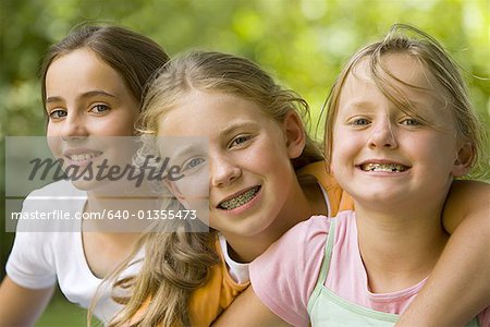 Portrait of three girls sitting together