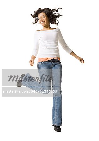 Portrait of a teenage girl jumping