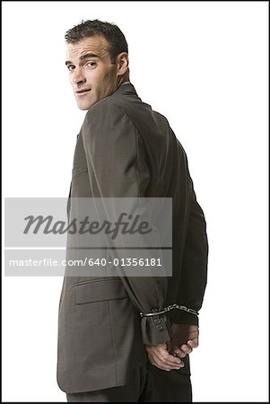 Portrait of a businessman in handcuffs