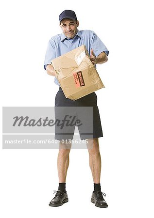 Portrait of a mailman holding a damaged package