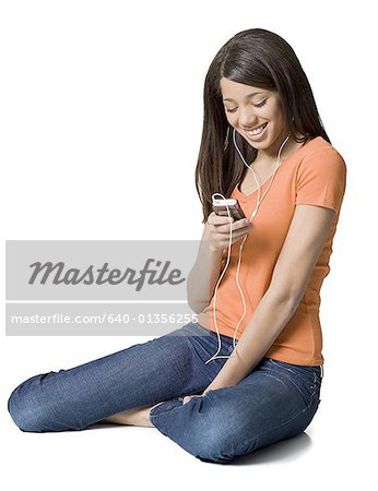 Girl looking at an MP3 player