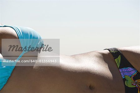 Close-up of a young woman sunbathing