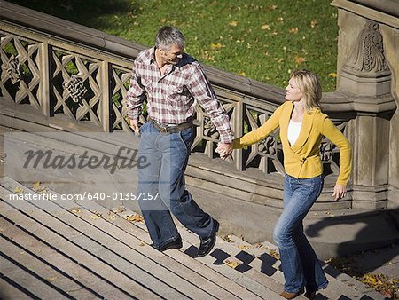 High angle view of a couple walking up stairs