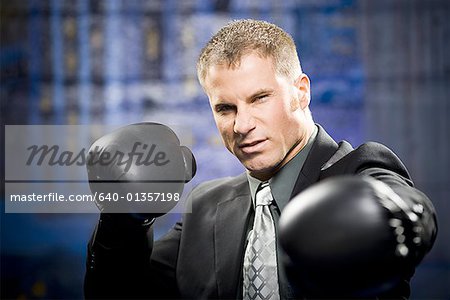Portrait of a businessman boxing