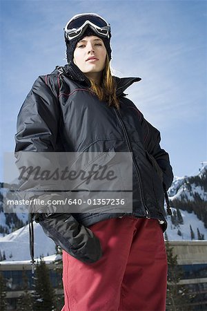 Low angle view of a young woman with her hand on her hip