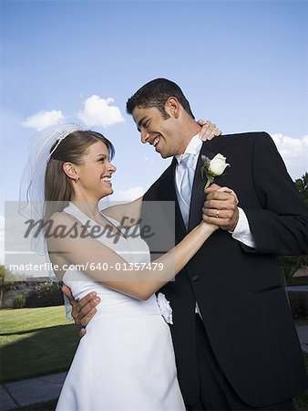 Close-up of a newlywed couple dancing
