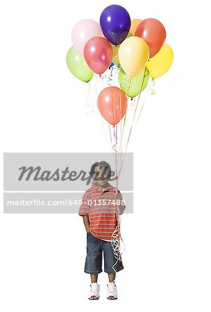 Young boy with balloons