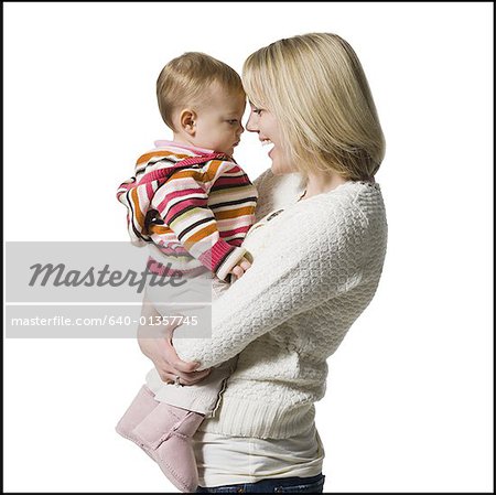 Woman holding baby girl