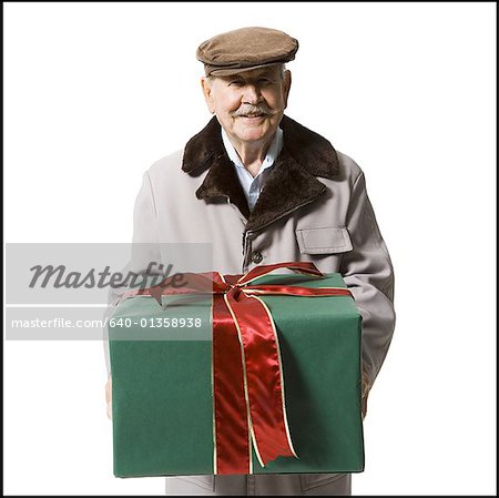 Older man holding present