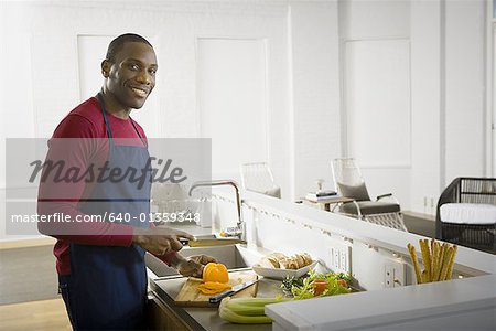 Portrait of a man preparing a meal