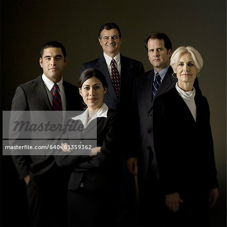 Portrait of five businesspeople standing