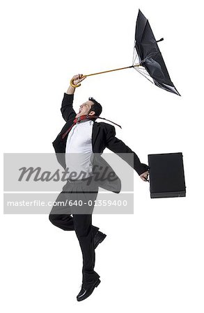 Voir le profil:: un homme d'affaires, tenir un parapluie et le saut