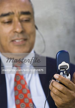 Close-up of a businessman looking at a mobile phone