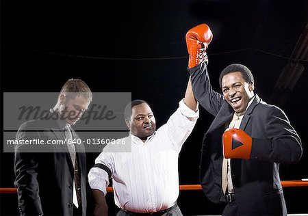 Referee declaring the winner of a boxing match