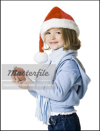 Portrait of a girl holding a Christmas ball