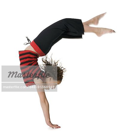 Side profile of a girl doing handstand
