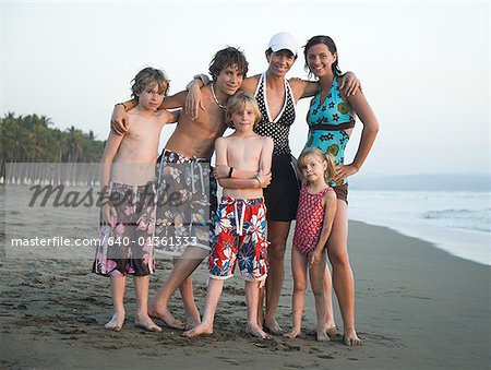 Mother with sons and daughters on beach