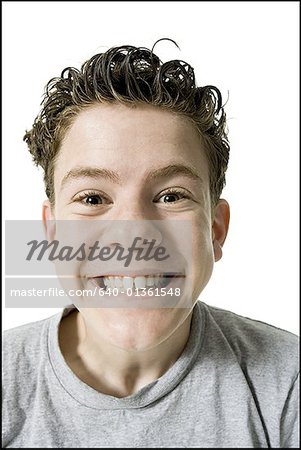 Portrait of a teenage boy grinning