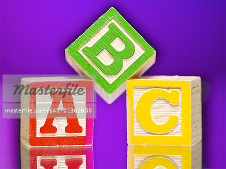 Close-up of three alphabet blocks