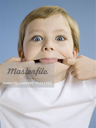 Portrait of boy sticking tongue out