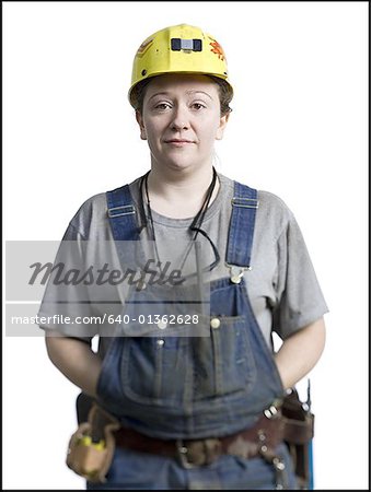 Portrait of a female coal miner standing with her hands in her pockets