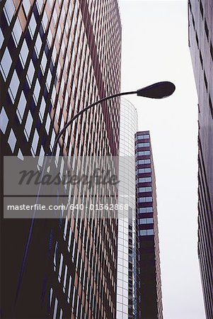 Low angle view of a street light in front of a building