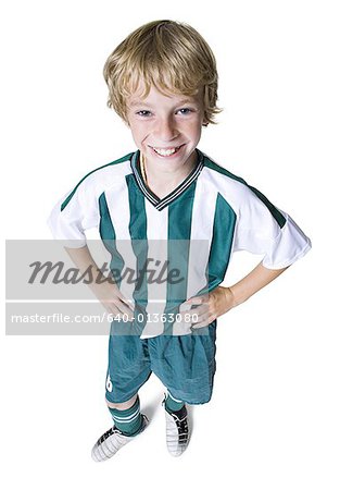 High angle view of a boy wearing soccer uniform