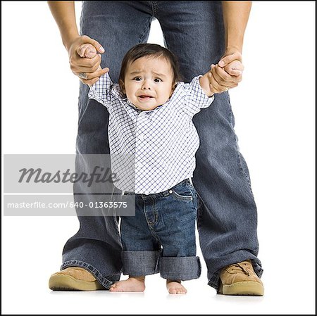 Father walking baby boy