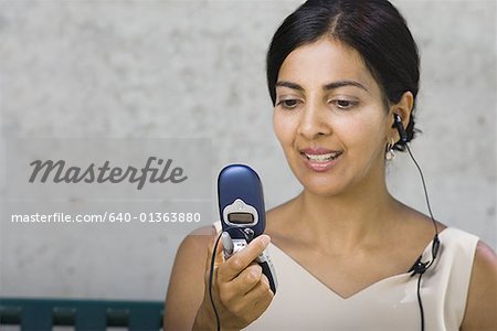 Close-up of a businesswoman looking at a mobile phone