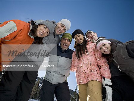 Low angle view of a group of people smiling