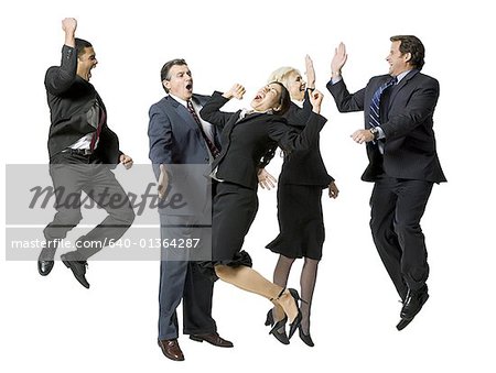 Five businesspeople leaping and smiling