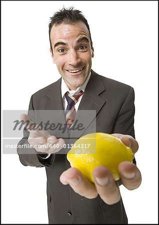 Man holding out a lemon