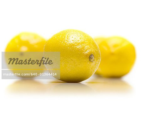 Close-up of three lemons