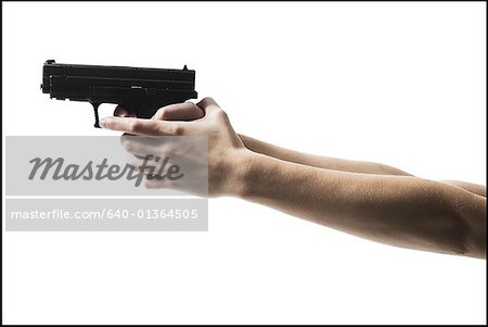 Woman's arms holding a handgun
