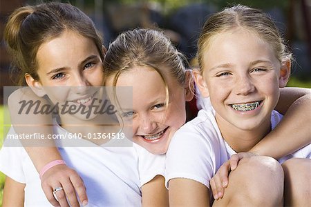 Portrait of three girls smiling