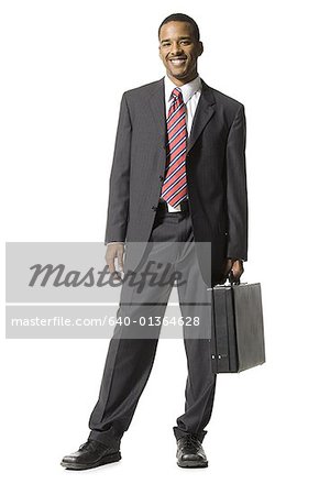 Businessman standing with briefcase