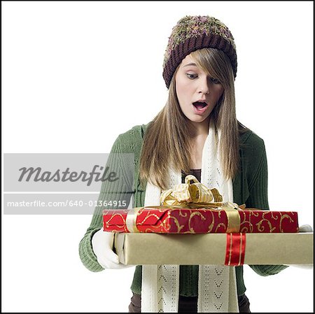 Girl looking at Christmas presents