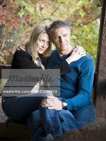 Couple embracing in a park