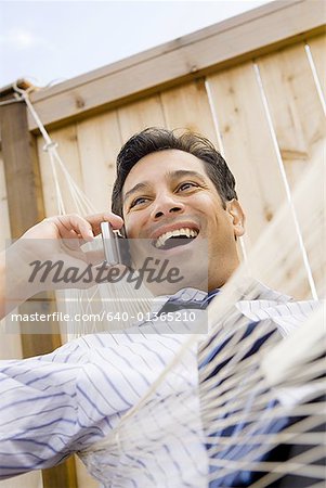 Low angle view of a businessman talking on the mobile phone