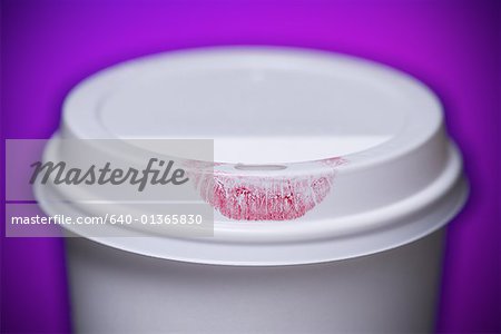 Close-up of a lipstick mark on a disposable cup