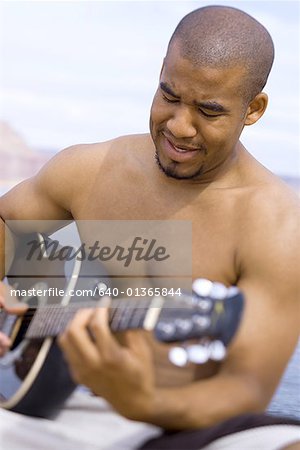 Young man playing a guitar